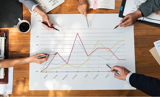 Team analyzing productivity trend charts together