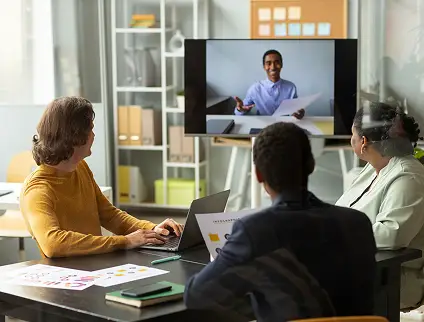 Dedicated client team collaborating with a remote stakeholder on video