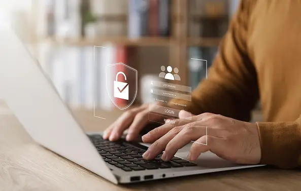 Employee securely logging into the TruTimer desktop application on a laptop